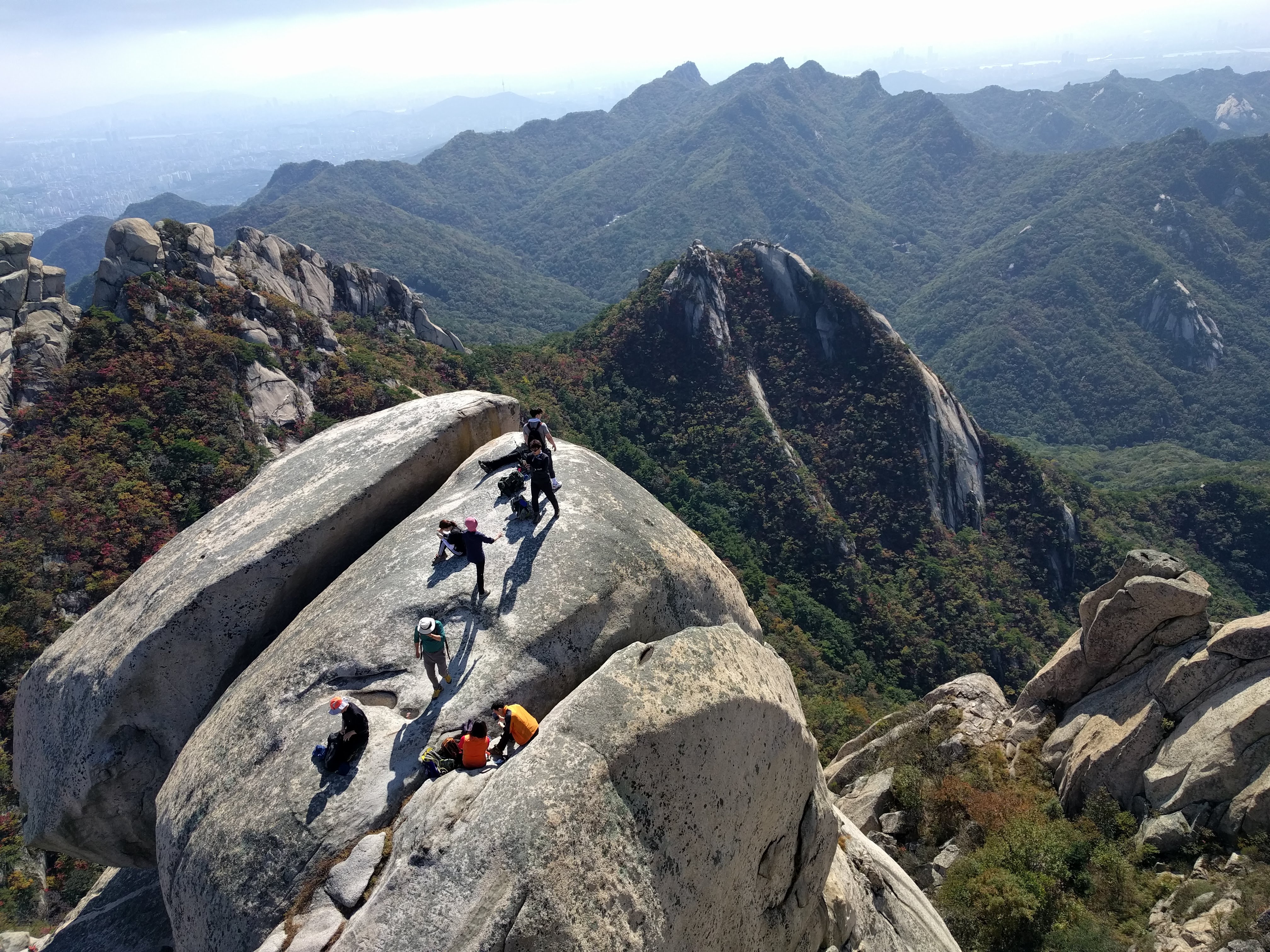 people climbing near the peak