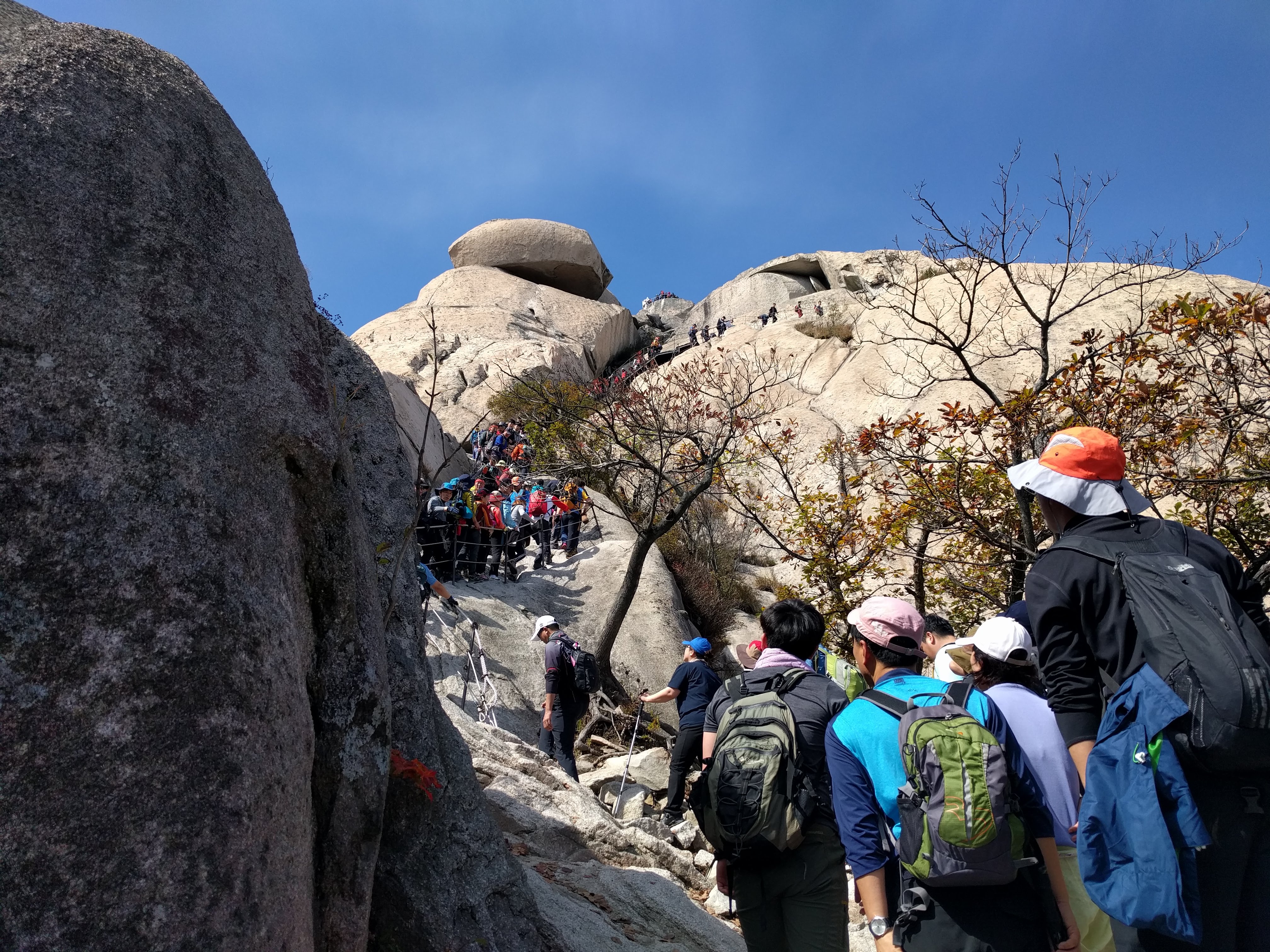 people queuing to get to the top